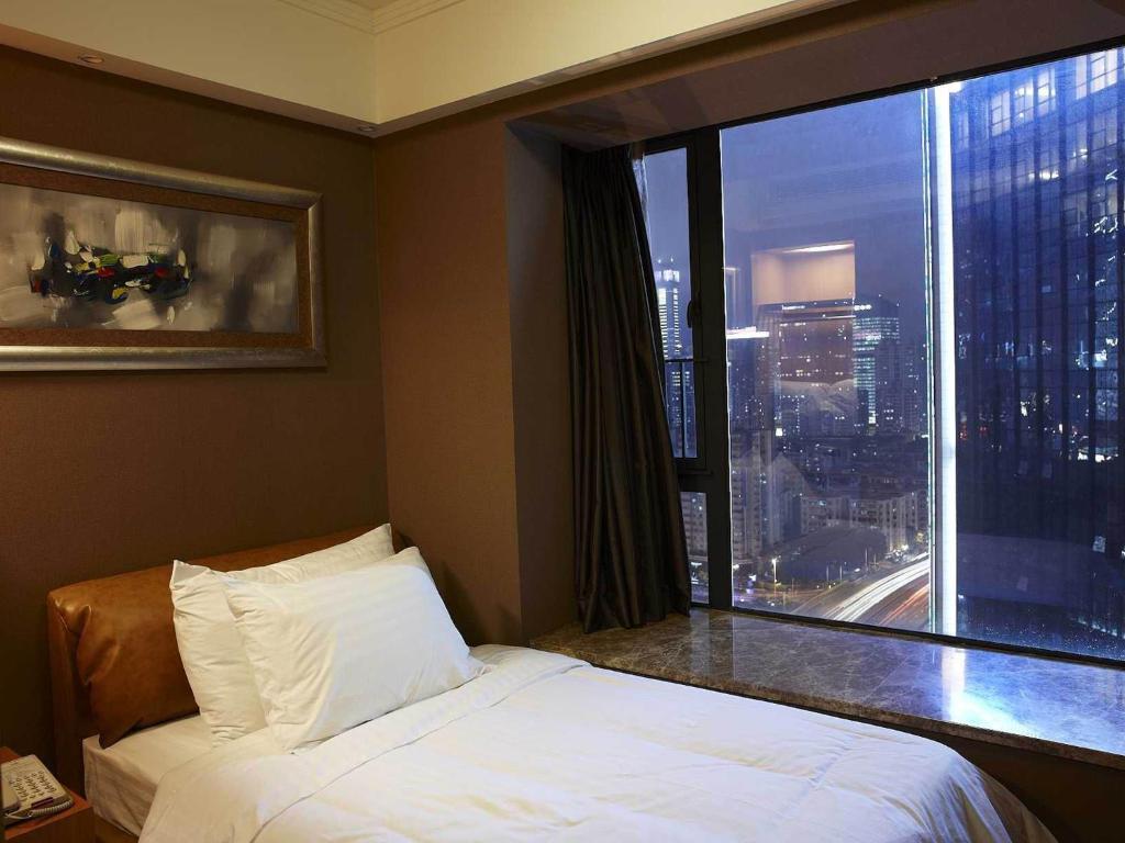 Dan Executive Hotel Apartment Zhujiang New Town Kanton Zimmer foto
